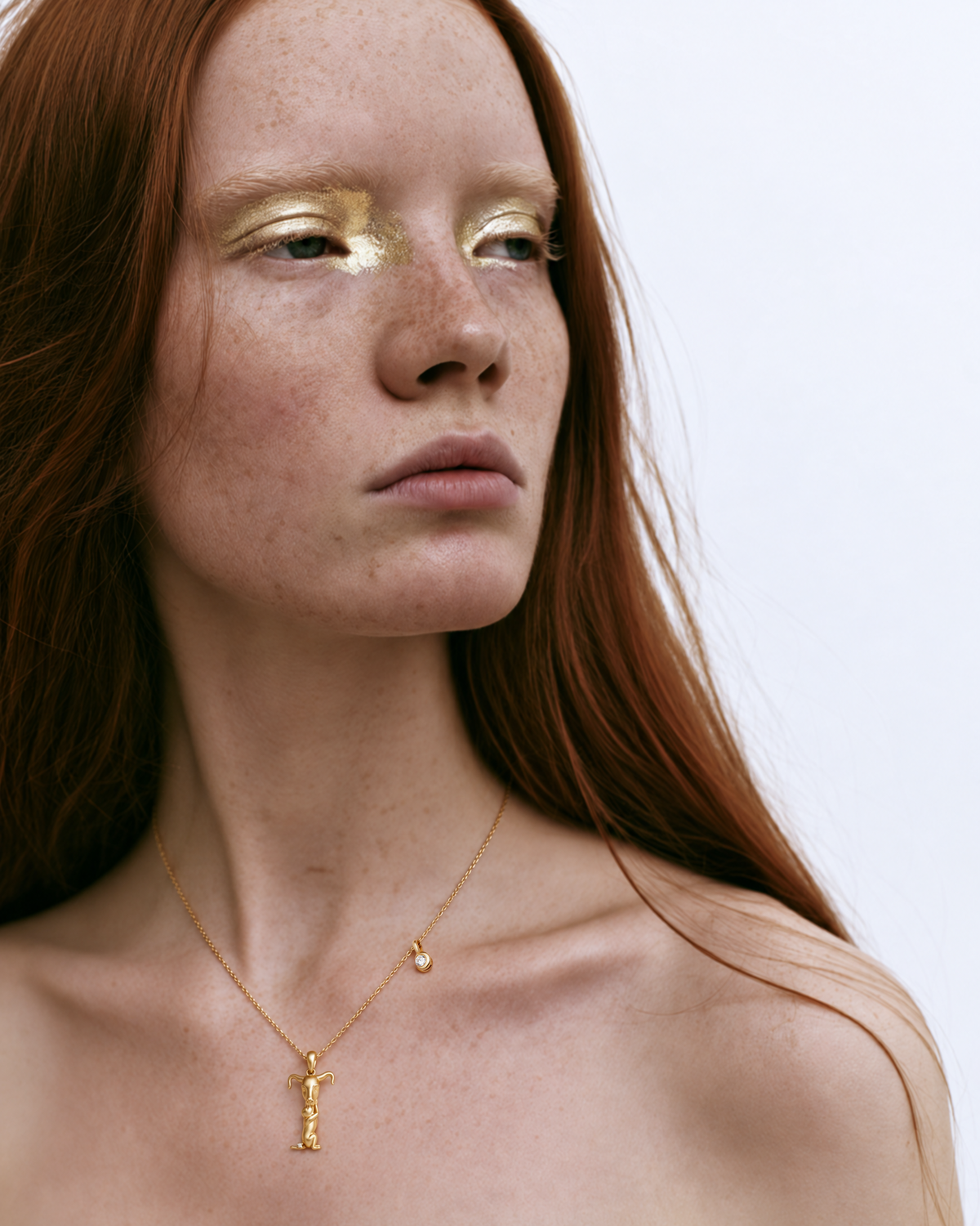Model wearing the gold T initial necklace