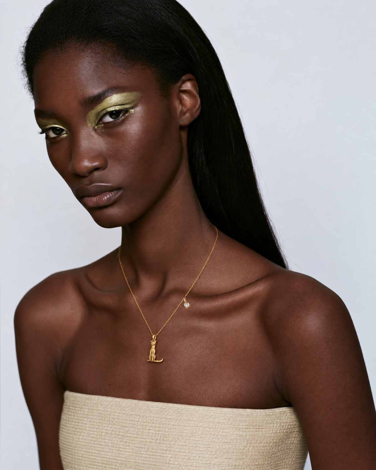 Model wearing the gold L initial necklace
